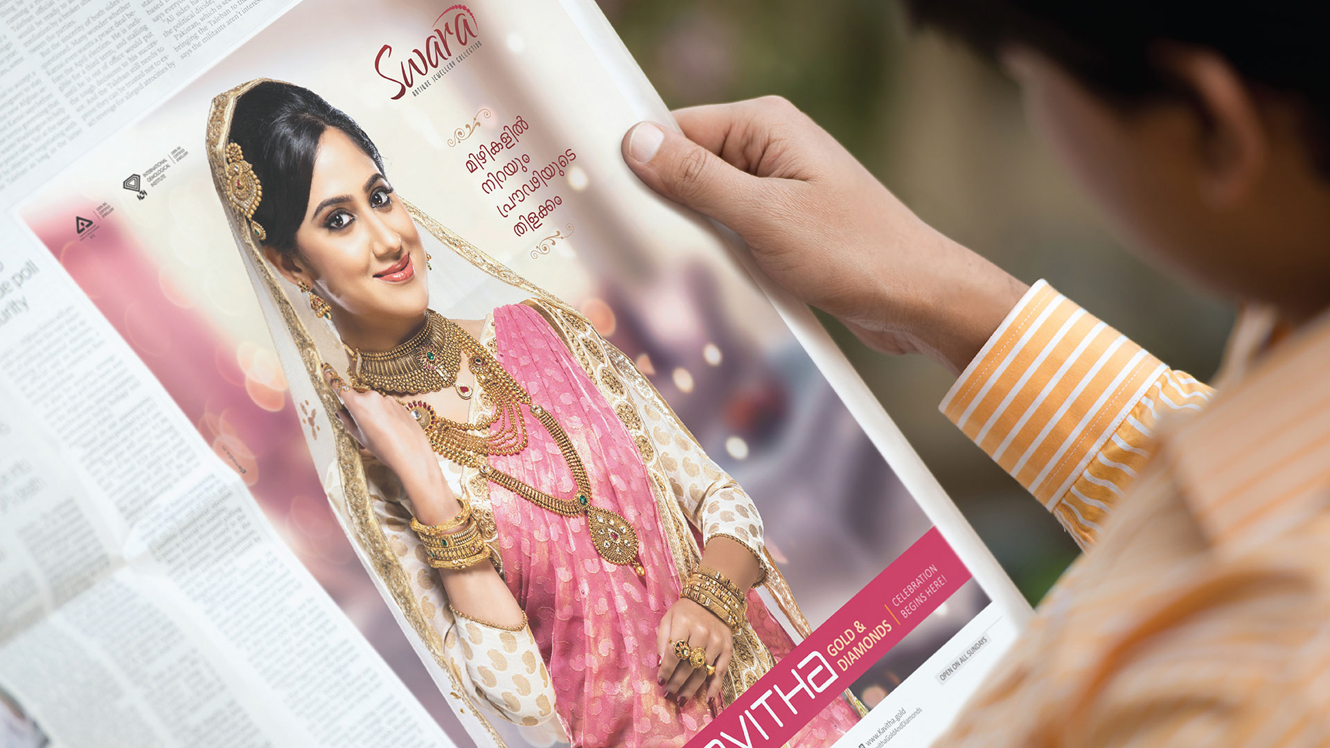 A person looking at a Kavitha Gold & Diamonds - Swara Collection newspaper Advertisement Modelling Actress Miya